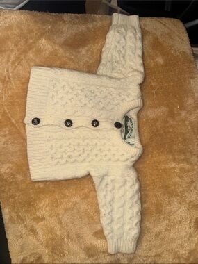 Arancrafts Ireland 
100% Merino wool
12-18 months